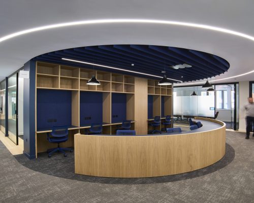 Granite acoustic ceiling baffles in high-traffic open-plan zone